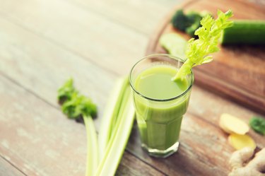 close up of fresh green juice glass and celery