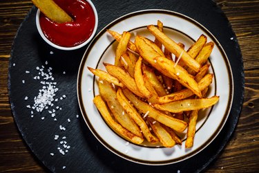 French fries on wooden background