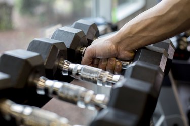 Lifting weights in gym