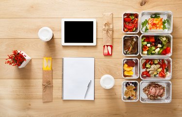 how to meal plan healthy food take away in boxes, top view at wood