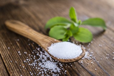 Old wooden table with Stevia Granules (selective focus)