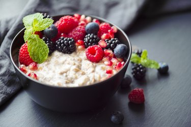 Healthy organic porridge topped with berries