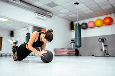 Doing push up on ball.