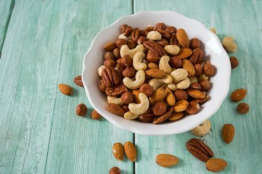 mixed nuts on wooden surface