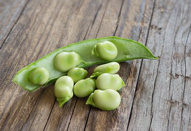 broad beans on wooden table