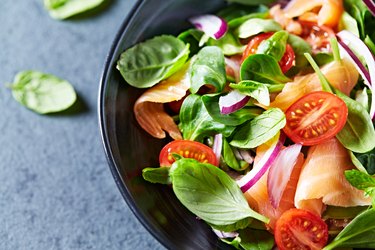 Leafy vegetable salad with smoked salmon, as an example of a low-calorie, high-volume meal