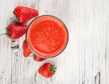 Fresh strawberry and juice in glass