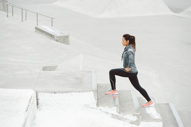 Fitness woman doing leg lunge exercise