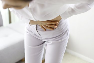 Close up of woman with stomachache