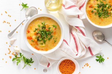 Vegetarian vegetable lentil soup with fresh parsley, healthy eating, top view