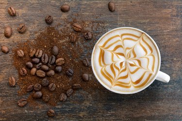 Caramel cappuccino with ground top view.