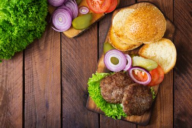 Directly Above Shot Of Burgers On Cutting Board