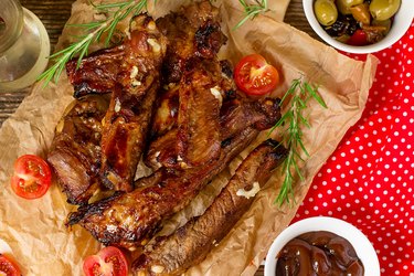 Baked barbecue glazed spare ribs of pork riblets with garlic