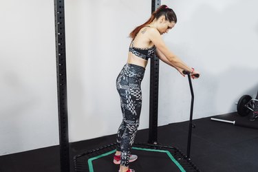 Woman jumping on mini trampoline