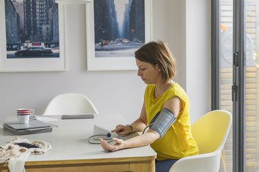 Woman checking blood pressure