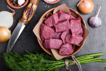 Raw chopped beef in ceramic bowl