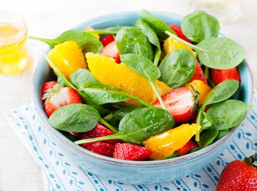 Fresh salad with strawberry, orange and spinach
