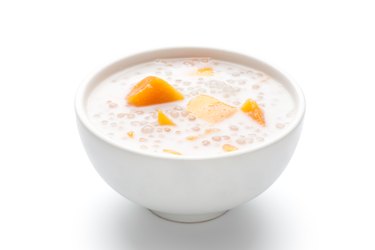 A bowl of sweet sago cream with mango and coconut milk