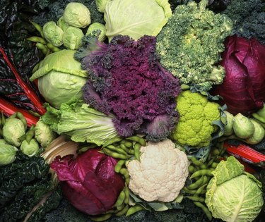 overhead of cruciferous vegetables including broccoli, cauliflower and cabbage