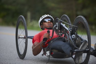 African American man riding a handcycle