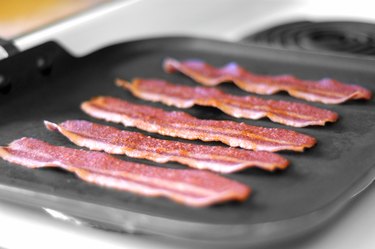 bacon frying in skillet