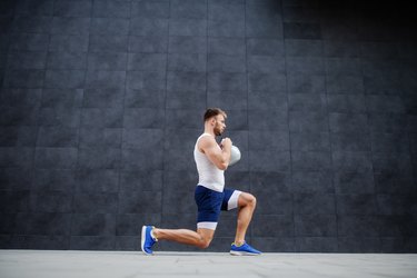 man doing lunges with kettlebell for a butt workout