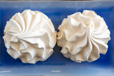 Two baked meringue kisses, sweet food