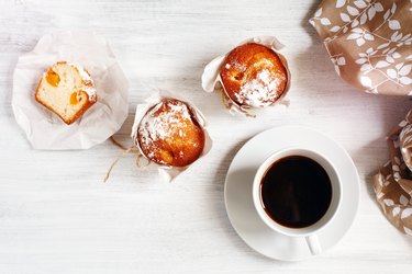 Sweet Fresh Baked Muffins with Cup of Coffee