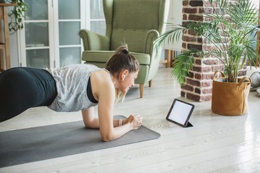 Woman exercising with workout program.