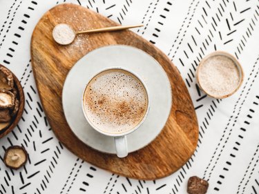 Top view of a chaga mushroom latte set on a patterned tablecloth