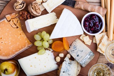 Cheese platter with fruits and wine