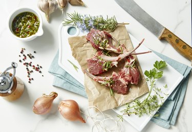 Raw fresh lamb chops with herbs and gremolata