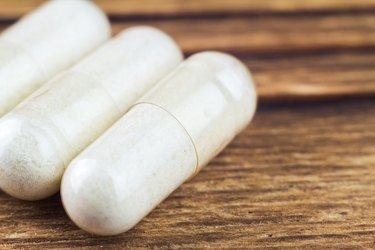 Food supplement pills, glucosamine capsules, macro image