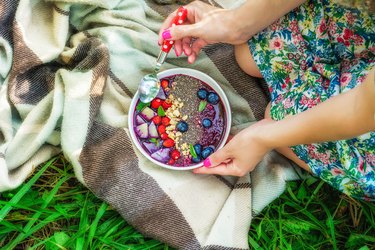 Woman holding smoothie bowl