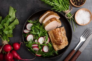 Roast pork fillet with arugula and radish salad