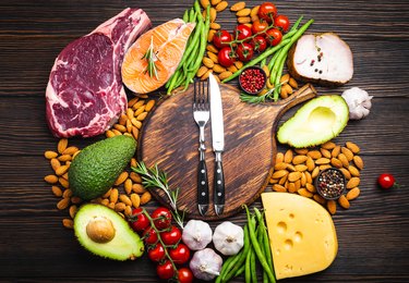 Top view of a selection of foods that are good sources of dietary fat