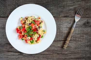 Scrambled eggs with onions, pepper and parsley