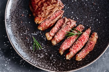 New York Striploin steak medium rare with rosemary top view