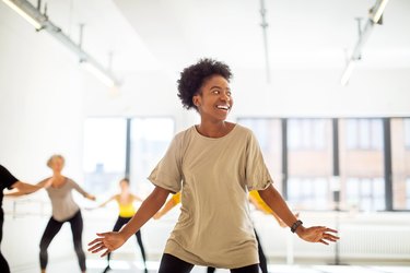 Woman practicing fitness dance moves