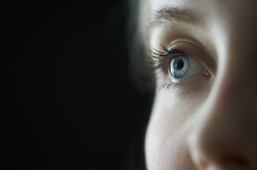 Female blue eye close up.