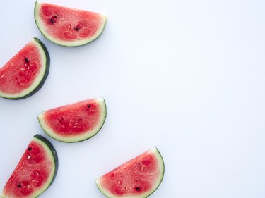 Sweet watermelon slices on white background