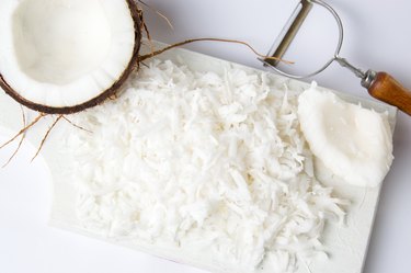 Grated coconut on a wooden board