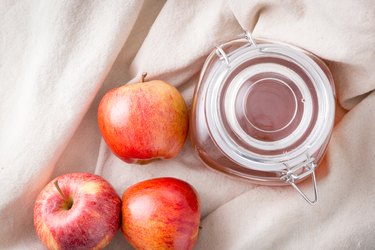 Top view of apple juice with fresh apples