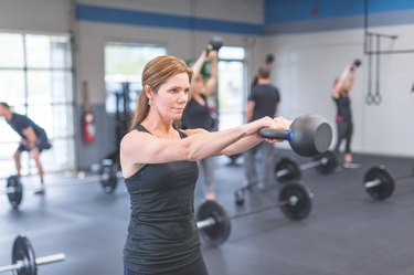 Woman doing a superset HIIT workout for beginners