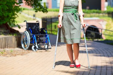 woman practicing walking on crutches