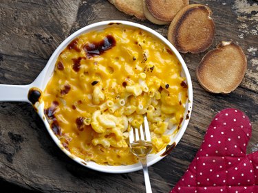 Macaroni and cheese in bowl with fork