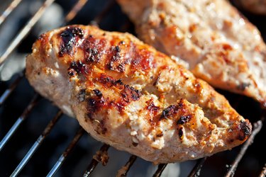 Grilled chicken breast on barbeque