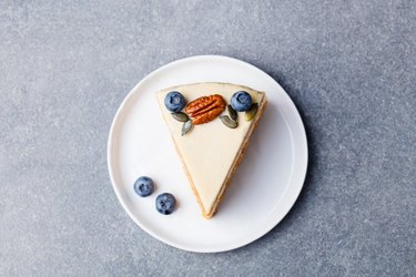 Vegan, raw carrot cake. Healthy food. Grey stone background. Top view.