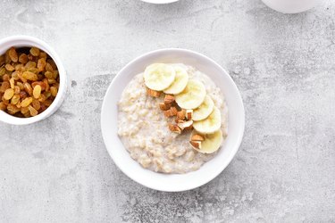 Oats porridge with banana slices and nuts