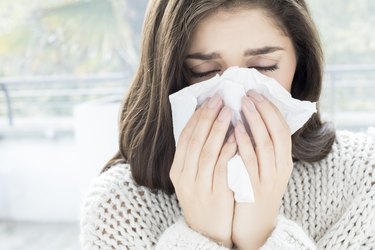 Woman with a nose bleed